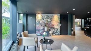 Area soggiorno di Fletcher Hotel - Resort Spaarnwoude