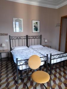 A bed or beds in a room at Albergo Milano 1920