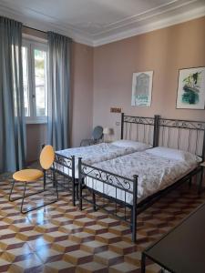 A bed or beds in a room at Albergo Milano 1920