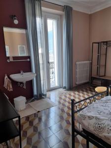A bed or beds in a room at Albergo Milano 1920