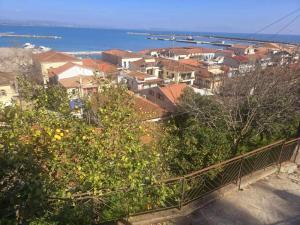 a view of a city with buildings and the ocean at Katakolo 2 Bedroom Apartment by MPS in Katakolon