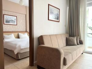 Postel nebo postele na pokoji v ubytování Agora Boutique Apart Hotel