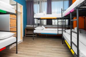 Llit o llits en una habitació de Amsterdam Teleport Hotel