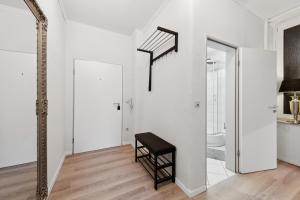 a white room with a staircase and a mirror at Charmanter Altbau in City Nähe in Osnabrück +18 photos