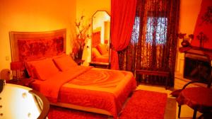 A bed or beds in a room at Asteras Hotel