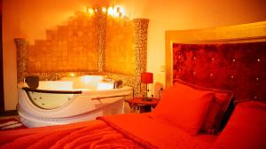 A bed or beds in a room at Asteras Hotel