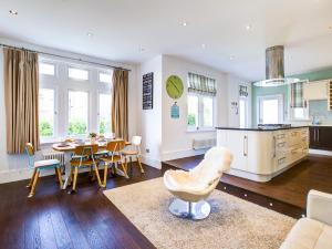 a kitchen and dining room with a table and chairs at Pass the Keys Large house Leigh Sea views in Southend-on-Sea