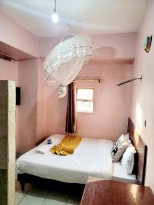 Postel nebo postele na pokoji v ubytování Sislink Hotel Nairobi