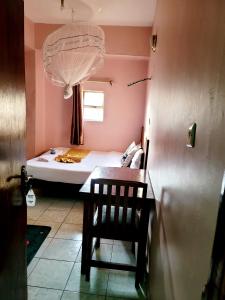 Postel nebo postele na pokoji v ubytování Sislink Hotel Nairobi
