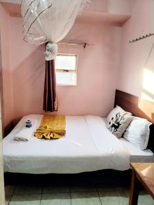 Postel nebo postele na pokoji v ubytování Sislink Hotel Nairobi