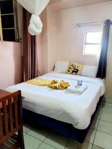 Postel nebo postele na pokoji v ubytování Sislink Hotel Nairobi