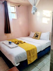 Postel nebo postele na pokoji v ubytování Sislink Hotel Nairobi