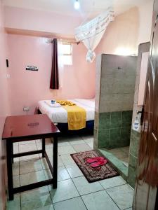 Postel nebo postele na pokoji v ubytování Sislink Hotel Nairobi