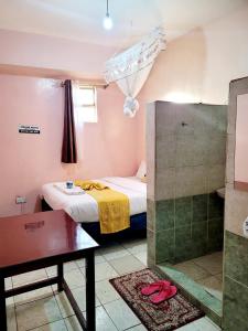 Postel nebo postele na pokoji v ubytování Sislink Hotel Nairobi