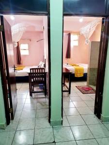 Postel nebo postele na pokoji v ubytování Sislink Hotel Nairobi