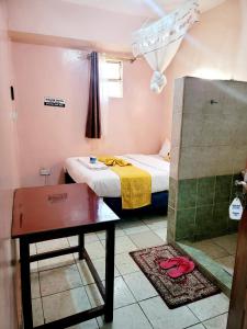 Postel nebo postele na pokoji v ubytování Sislink Hotel Nairobi