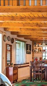 a kitchen and dining room with a wooden ceiling at Holiday home Szentantalfa - Balaton 20230 in Szentantalfa +42 photos