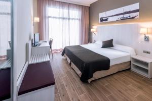 Postel nebo postele na pokoji v ubytování GHT Costa Brava & Spa