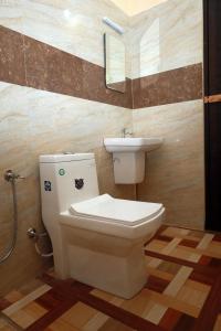 a bathroom with a toilet and a sink at Hill view Homestay pullikkanam vagamon in Vagamon