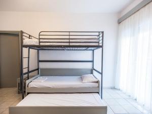 Postel nebo postele na pokoji v ubytování Afkos Apartments