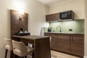 Kuchyň nebo kuchyňský kout v ubytování Hotel Ohlenhoff