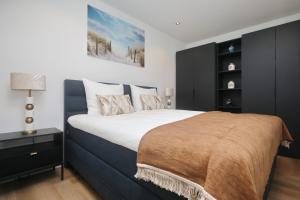 Postel nebo postele na pokoji v ubytování Steenhof Beach House