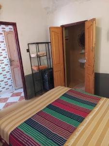 Postel nebo postele na pokoji v ubytování Riad Tigmi du Soleil