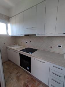 Kuchyň nebo kuchyňský kout v ubytování Appartamento SoleeMare