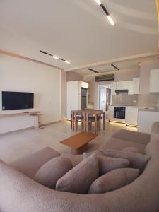 a living room with a couch and a table at A Residence - Superior One Bedroom Aparthotel in Sharm El Sheikh