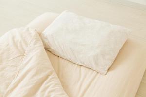 A bed or beds in a room at RV park plus Numata Kenko Land
