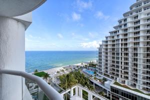 a view of the ocean from a balcony of a building at Stylish Oceanview Apartment Prime Location in Fort Lauderdale