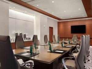 a conference room with a long table and chairs at Stylish Oceanview Apartment Prime Location in Fort Lauderdale