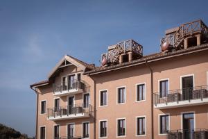 a large building with balconies on top of it at Palazzo dei Guardiani in Venice