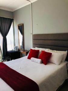 Ένα ή περισσότερα κρεβάτια σε δωμάτιο στο Angelome B&B