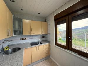 a kitchen with a sink and a window at Casa Verana en Asturias VV-3421-AS in Granda +48 photos