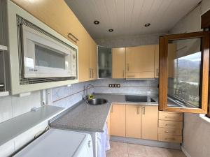 a small kitchen with a sink and a window at Casa Verana en Asturias VV-3421-AS in Granda