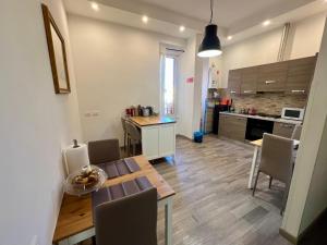 a kitchen and dining room with a table and chairs at Enjoy Vatican in Rome +11 photos