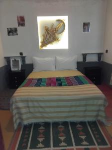 Postel nebo postele na pokoji v ubytování Riad Tigmi du Soleil