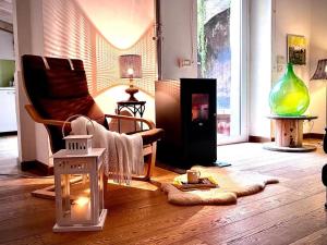 a living room with a couch and a fireplace at La Siciliana in Acireale
