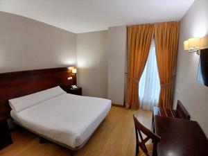 Postel nebo postele na pokoji v ubytování Hotel Campos de Castilla