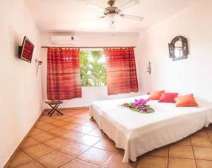 Postel nebo postele na pokoji v ubytování Hotel Laguna del Cocodrilo