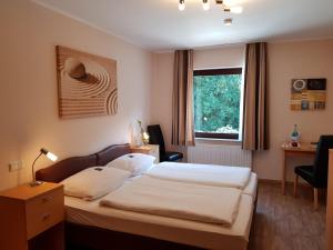 Postel nebo postele na pokoji v ubytování Gasthof Bucksande