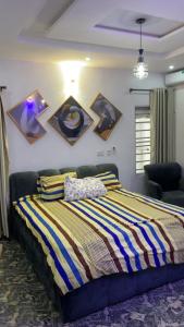 Postel nebo postele na pokoji v ubytování Sea-Love Apartment In Ado-Ekiti