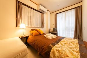 Letto o letti in una camera di 015T Y's INN 有客 瑞江 瑞江駅まで徒歩6分新宿まで乗換なし36分 3階建貸切 大人数向け ドンキそば