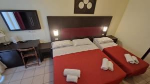 Posteľ alebo postele v izbe v ubytovaní Hotel Alibi
