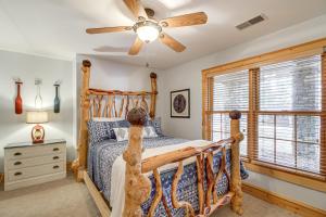 a bedroom with a bed and a ceiling fan at Sprawling Minnesota Home with On-Site Lake Access in Lake Shore