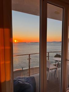 a view of the ocean from a room with a window at Deluxe Apartments Shengjin in Shëngjin