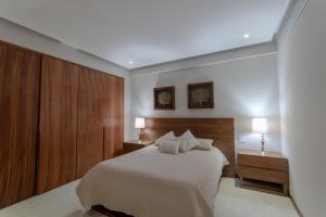 Postel nebo postele na pokoji v ubytování Bolongo Spectacular Punta Mita Beachfront