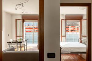 a room with a bed and a table with a dining room at Maranello Suite in Maranello +23 photos
