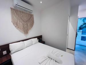 Postel nebo postele na pokoji v ubytování Coco Live Suites